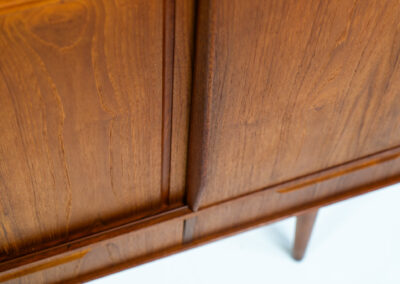 Sideboard by E.W. Bach for Sejling Skabe (Denmark, 1960s). A very elegant piece with ideal dimensions. It contains three sliding doors and three drawers with nice sculptural handles. The inside has lots of storage space with adjustable shelves and 2 small drawers aswel. An amazing Danish quality piece ready for another lifetime! In very good condition with some minor repair marks.