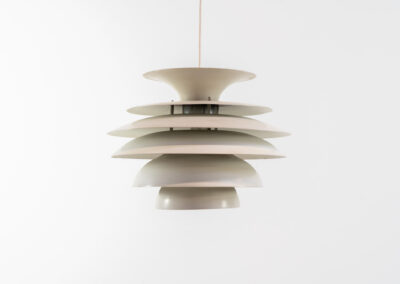 “Barcelona” pendant light by Bent Karlby for Lyfa (Denmark, 1960s). A beatiful design classic made up of six aluminium shades that create a nice indirect light distribution. A true eye catcher. In good vintage condition!