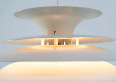 “Barcelona” pendant light by Bent Karlby for Lyfa (Denmark, 1960s). A beatiful design classic made up of six aluminium shades that create a nice indirect light distribution. A true eye catcher. In good vintage condition!