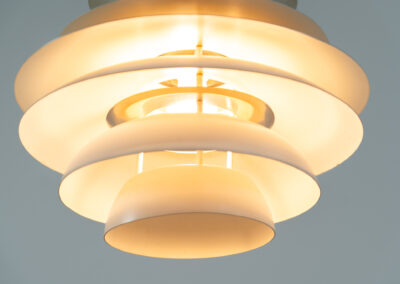 “Barcelona” pendant light by Bent Karlby for Lyfa (Denmark, 1960s). A beatiful design classic made up of six aluminium shades that create a nice indirect light distribution. A true eye catcher. In good vintage condition!