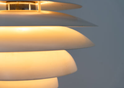 “Barcelona” pendant light by Bent Karlby for Lyfa (Denmark, 1960s). A beatiful design classic made up of six aluminium shades that create a nice indirect light distribution. A true eye catcher. In good vintage condition!