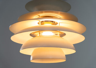 “Barcelona” pendant light by Bent Karlby for Lyfa (Denmark, 1960s). A beatiful design classic made up of six aluminium shades that create a nice indirect light distribution. A true eye catcher. In good vintage condition!