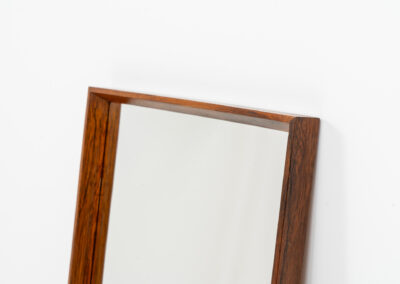 Mid-Century wall mirror in rosewood by Aarhus Glassliberi (Denmark, 1960s). Perfectly built, amazing woodgrain and very timeless. In good condition. Labeled on the back.