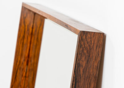 Mid-Century wall mirror in rosewood by Aarhus Glassliberi (Denmark, 1960s). Perfectly built, amazing woodgrain and very timeless. In good condition. Labeled on the back.