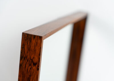 Mid-Century wall mirror in rosewood by Aarhus Glassliberi (Denmark, 1960s). Perfectly built, amazing woodgrain and very timeless. In good condition. Labeled on the back.