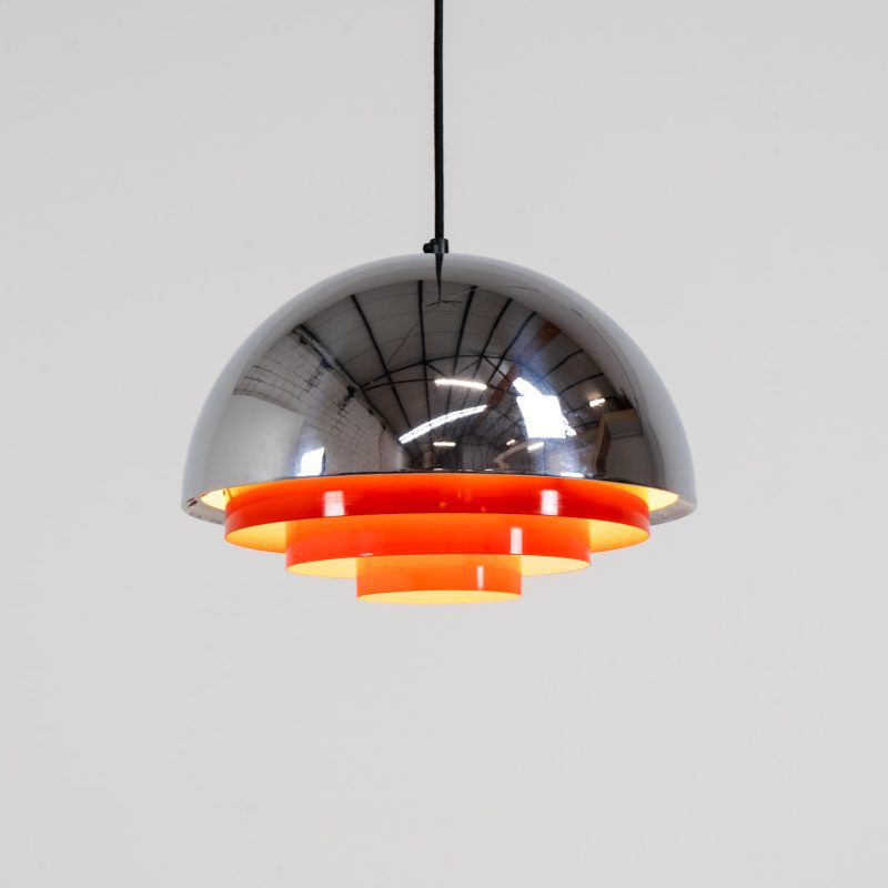 Stunning “Milieu” pendant light by Jo Hammerborg for Fog & Mørup (Denmark, 1960s). The condition of this piece is just amazing! It’s made out of a chrome lamp shade and deep orange metal light diffusers. Beautiful lighting, beautiful design and splendid original condition.