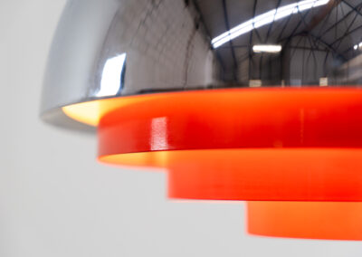 Stunning “Milieu” pendant light by Jo Hammerborg for Fog & Mørup (Denmark, 1960s). The condition of this piece is just amazing! It’s made out of a chrome lamp shade and deep orange metal light diffusers. Beautiful lighting, beautiful design and splendid original condition.