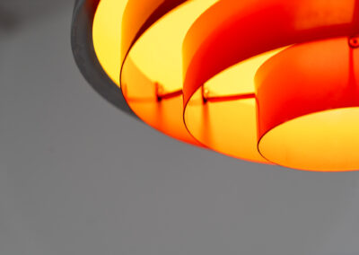 Stunning “Milieu” pendant light by Jo Hammerborg for Fog & Mørup (Denmark, 1960s). The condition of this piece is just amazing! It’s made out of a chrome lamp shade and deep orange metal light diffusers. Beautiful lighting, beautiful design and splendid original condition.