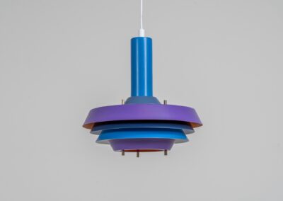 Model 705 pendant light by Lyskaer (Denmark, 1960s). This space age beauty contains 4 aluminium shades, lacquered in blue, purple and an orange interior. Newly rewired and restored to perfection.