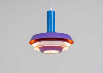 Model 705 pendant light by Lyskaer (Denmark, 1960s). This space age beauty contains 4 aluminium shades, lacquered in blue, purple and an orange interior. Newly rewired and restored to perfection.
