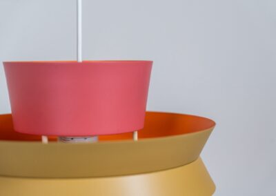 Colourful “Trava” pendant light designed by Carl Thore for Granhaga (Sweden, 1960s). This lamp is surely an eye catcher! It is made out of four aluminium shades laquered in two tints of pink, ocher yellow and an orange interior. The lamp is rewired and restored to perfection!