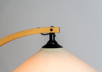 Stunning Caprani floor lamp by Mads Caprani (Denmark, 1970s). It features a nicely curved beech wood stand and a cast iron base, engraved with ‘Caprani Light’. A very elegant and hard to find piece! This one has an unusual shade compared with most models, with the Caprani logo inside. In very good condition.