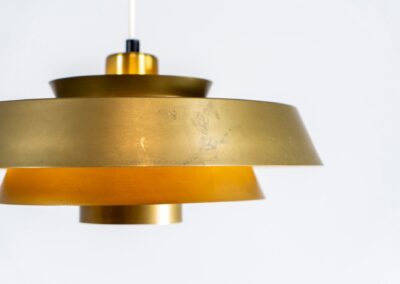 Nova pendant light by Jo Hammerborg for Fog & Mørup (Denmark, 1960s). A wonderful design classic. It is made out of solid brass and has a beatiful patina. In original and very good vintage condition.