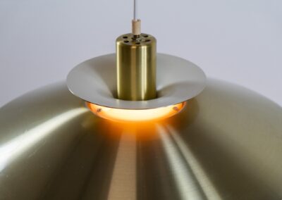 Brass colored pendant light by Frandsen (Denmark, 1970s). A beautiful lamp made out of four aluminium shades with a brass colored exterior. Newly rewired and in very good condition. Labeled by maker.