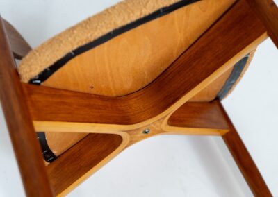 Remarkable set of 5 teak dining chairs by Harry Østergaard for Randers Møbelfabrik (Denmark, 1950s). Excellent craftsmanship! Featuring a beautifully curved backrest and a bentwood curved x-shaped base. They are fully restored and newly upholstered in an earthy orange/brown bouclé fabric. Ready for another lifetime!