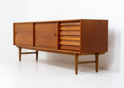 Exceptional sideboard from the Platon series by Lothar Wegner (Germany, 1960s). This is one of our favorite sideboards! The combination of the sleek lines and the organic drawers is just amazing. It has subtle round inset handles and a beautiful warm woodgrain. Featuring two big sliding doors, three drawers and lots of storage space. In very good condition!