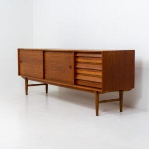 Exceptional sideboard from the Platon series by Lothar Wegner (Germany, 1960s). This is one of our favorite sideboards! The combination of the sleek lines and the organic drawers is just amazing. It has subtle round inset handles and a beautiful warm woodgrain. Featuring two big sliding doors, three drawers and lots of storage space. In very good condition!
