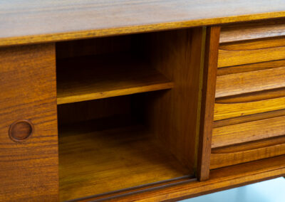 Exceptional sideboard from the Platon series by Lothar Wegner (Germany, 1960s). This is one of our favorite sideboards! The combination of the sleek lines and the organic drawers is just amazing. It has subtle round inset handles and a beautiful warm woodgrain. Featuring two big sliding doors, three drawers and lots of storage space. In very good condition!