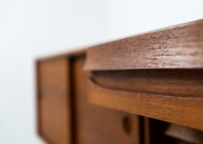 Exceptional sideboard from the Platon series by Lothar Wegner (Germany, 1960s). This is one of our favorite sideboards! The combination of the sleek lines and the organic drawers is just amazing. It has subtle round inset handles and a beautiful warm woodgrain. Featuring two big sliding doors, three drawers and lots of storage space. In very good condition!