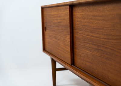 Exceptional sideboard from the Platon series by Lothar Wegner (Germany, 1960s). This is one of our favorite sideboards! The combination of the sleek lines and the organic drawers is just amazing. It has subtle round inset handles and a beautiful warm woodgrain. Featuring two big sliding doors, three drawers and lots of storage space. In very good condition!