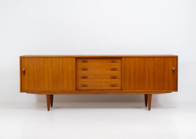 Teak sideboard by Clausen & Son (Denmark, 1960s). It features 2 sliding doors, adjustable shelves inside, 4 central drawers and nice sculptural handles. A high quality masterpiece in splendid condition! Marked by maker on the back.