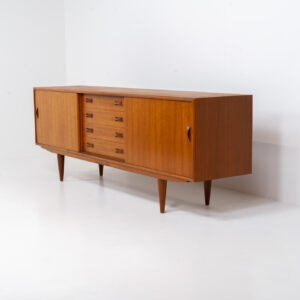 Teak sideboard by Clausen & Son (Denmark, 1960s). It features 2 sliding doors, adjustable shelves inside, 4 central drawers and nice sculptural handles. A high quality masterpiece in splendid condition! Marked by maker on the back.