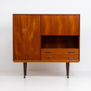 Rare bar cabinet by van Pelt (Belgium, 1960s). A minimalistic piece made with high quality. It contains a main door with three adjustable shelves on this inside, a drop-door with storage space for glasses and bottles, two drawers and an open shelve. The locks still work smoothly and two original keys are included. It has convenient and compact dimensions and a magnificent woodgrain. In very good condition!