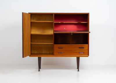 Rare bar cabinet by van Pelt (Belgium, 1960s). A minimalistic piece made with high quality. It contains a main door with three adjustable shelves on this inside, a drop-door with storage space for glasses and bottles, two drawers and an open shelve. The locks still work smoothly and two original keys are included. It has convenient and compact dimensions and a magnificent woodgrain. In very good condition!