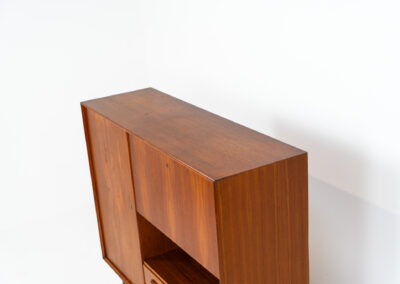 Rare bar cabinet by van Pelt (Belgium, 1960s). A minimalistic piece made with high quality. It contains a main door with three adjustable shelves on this inside, a drop-door with storage space for glasses and bottles, two drawers and an open shelve. The locks still work smoothly and two original keys are included. It has convenient and compact dimensions and a magnificent woodgrain. In very good condition!