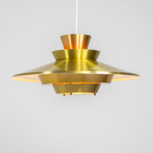 Brass colored pendant light (Denmark, 1970s). We don’t know who made this one but it’s definitely a beautiful piece! Parts of the inside are lacquered in orange which gives a nice effect when turned on. In very good condition with some minor scratches.