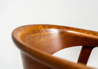 Model 52 armchair by Erik Kirkegaard for Høng Stolefabrik (Denmark, 1960s). What a stunning piece of art… The Model 52, also known as the Compass chair is a hard to find chair made out of solid teak. The details on this one are just amazing and the generously curved and rounded backrest makes it a pleasure to sit in! The seat is newly upholstered in real leather and it is in very good condition!