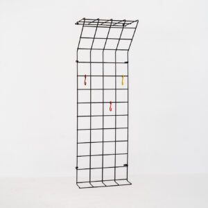 Wall-mounted wire coatrack by Karl Fichtel for Drahtwerke Erlau (Germany, 1950s). It’s made out of black metal wire and features a hat shelf, an umbrella stand and three colored hooks. It has plenty of room to hang more hooks or coat hangers if needed. It’s easily mountable to the wall with six screws. In very good condition!