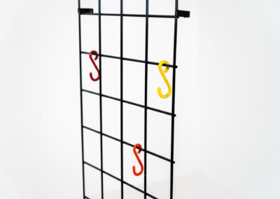 Wall-mounted wire coatrack by Karl Fichtel for Drahtwerke Erlau (Germany, 1950s). It’s made out of black metal wire and features a hat shelf, an umbrella stand and three colored hooks. It has plenty of room to hang more hooks or coat hangers if needed. It’s easily mountable to the wall with six screws. In very good condition!
