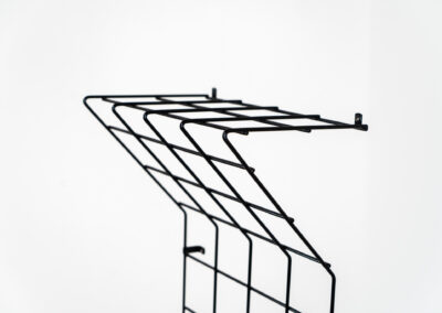 Wall-mounted wire coatrack by Karl Fichtel for Drahtwerke Erlau (Germany, 1950s). It’s made out of black metal wire and features a hat shelf, an umbrella stand and three colored hooks. It has plenty of room to hang more hooks or coat hangers if needed. It’s easily mountable to the wall with six screws. In very good condition!