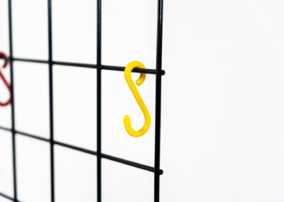 Wall-mounted wire coatrack by Karl Fichtel for Drahtwerke Erlau (Germany, 1950s). It’s made out of black metal wire and features a hat shelf, an umbrella stand and three colored hooks. It has plenty of room to hang more hooks or coat hangers if needed. It’s easily mountable to the wall with six screws. In very good condition!