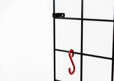 Wall-mounted wire coatrack by Karl Fichtel for Drahtwerke Erlau (Germany, 1950s). It’s made out of black metal wire and features a hat shelf, an umbrella stand and three colored hooks. It has plenty of room to hang more hooks or coat hangers if needed. It’s easily mountable to the wall with six screws. In very good condition!