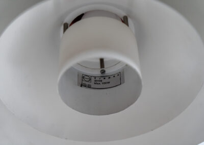 Trapez pendant light by Christian Hvidt for Nordisk Solar (Denmark, 1970s). A minimalistic design with 3 graduated shades attached to a cylindrical centre tube. Made to spread a soothing indirect light. In good condition with some visible using traces.