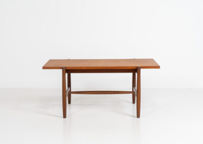 Stunning compact coffee table by Asko (Finland, 1960s). It consists of a tapered solid teak frame and a teak veneered table top. In very good condition. Labeled by maker.