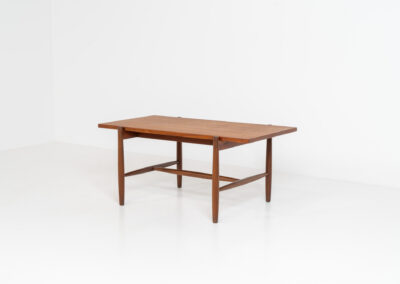 Stunning compact coffee table by Asko (Finland, 1960s). It consists of a tapered solid teak frame and a teak veneered table top. In very good condition. Labeled by maker.