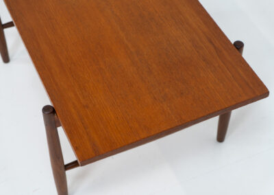 Stunning compact coffee table by Asko (Finland, 1960s). It consists of a tapered solid teak frame and a teak veneered table top. In very good condition. Labeled by maker.