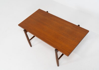 Stunning compact coffee table by Asko (Finland, 1960s). It consists of a tapered solid teak frame and a teak veneered table top. In very good condition. Labeled by maker.