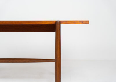 Stunning compact coffee table by Asko (Finland, 1960s). It consists of a tapered solid teak frame and a teak veneered table top. In very good condition. Labeled by maker.