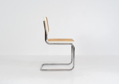 Italian wicker chair (Italy, 1970s). An iconic and contemporary design. The chair consists of white lacquered beech wood with cane webbing and a chrome frame, all in very good condition. It has a ‘made in Italy’ stamp underneath.