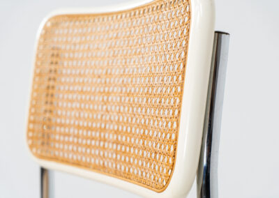 Italian wicker chair (Italy, 1970s). An iconic and contemporary design. The chair consists of white lacquered beech wood with cane webbing and a chrome frame, all in very good condition. It has a ‘made in Italy’ stamp underneath.