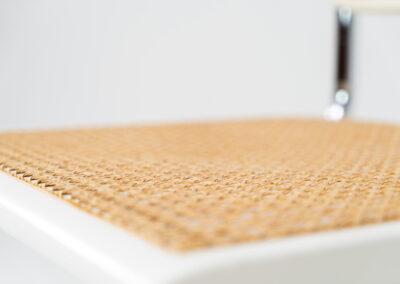 Italian wicker chair (Italy, 1970s). An iconic and contemporary design. The chair consists of white lacquered beech wood with cane webbing and a chrome frame, all in very good condition. It has a ‘made in Italy’ stamp underneath.