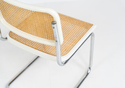 Italian wicker chair (Italy, 1970s). An iconic and contemporary design. The chair consists of white lacquered beech wood with cane webbing and a chrome frame, all in very good condition. It has a ‘made in Italy’ stamp underneath.