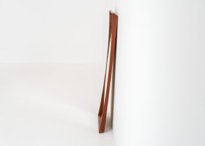 Elegant Mid-Century wall mirror (Denmark, 1960s). Featuring a beautiful organic frame in solid teak, a black trim and a faceted glass mirror. The combination of the curved frame and the black trim makes this mirror a pleasure for the eyes! In very good condition.