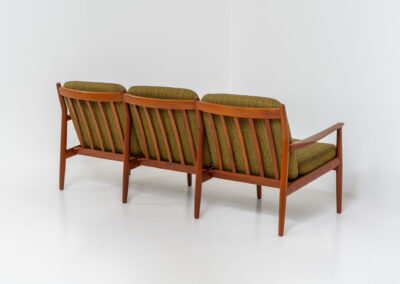 Impressive 3-seater sofa by Grete Jalk for Glostrup (Denmark, 1960s). What an eye catcher.. it features a solid teak frame which is beautifully sculpted and the original cushions! The green/yellow wool fabric is original aswell and remains in amazing condition. Obviously an example of true Scandinavian craftsmanship. It is a pleasure for the eyes and a pleasure to sit in! Marked by maker.