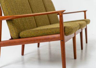 Impressive 3-seater sofa by Grete Jalk for Glostrup (Denmark, 1960s). What an eye catcher.. it features a solid teak frame which is beautifully sculpted and the original cushions! The green/yellow wool fabric is original aswell and remains in amazing condition. Obviously an example of true Scandinavian craftsmanship. It is a pleasure for the eyes and a pleasure to sit in! Marked by maker.