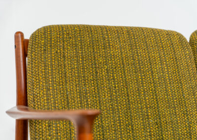 Impressive 3-seater sofa by Grete Jalk for Glostrup (Denmark, 1960s). What an eye catcher.. it features a solid teak frame which is beautifully sculpted and the original cushions! The green/yellow wool fabric is original aswell and remains in amazing condition. Obviously an example of true Scandinavian craftsmanship. It is a pleasure for the eyes and a pleasure to sit in! Marked by maker.